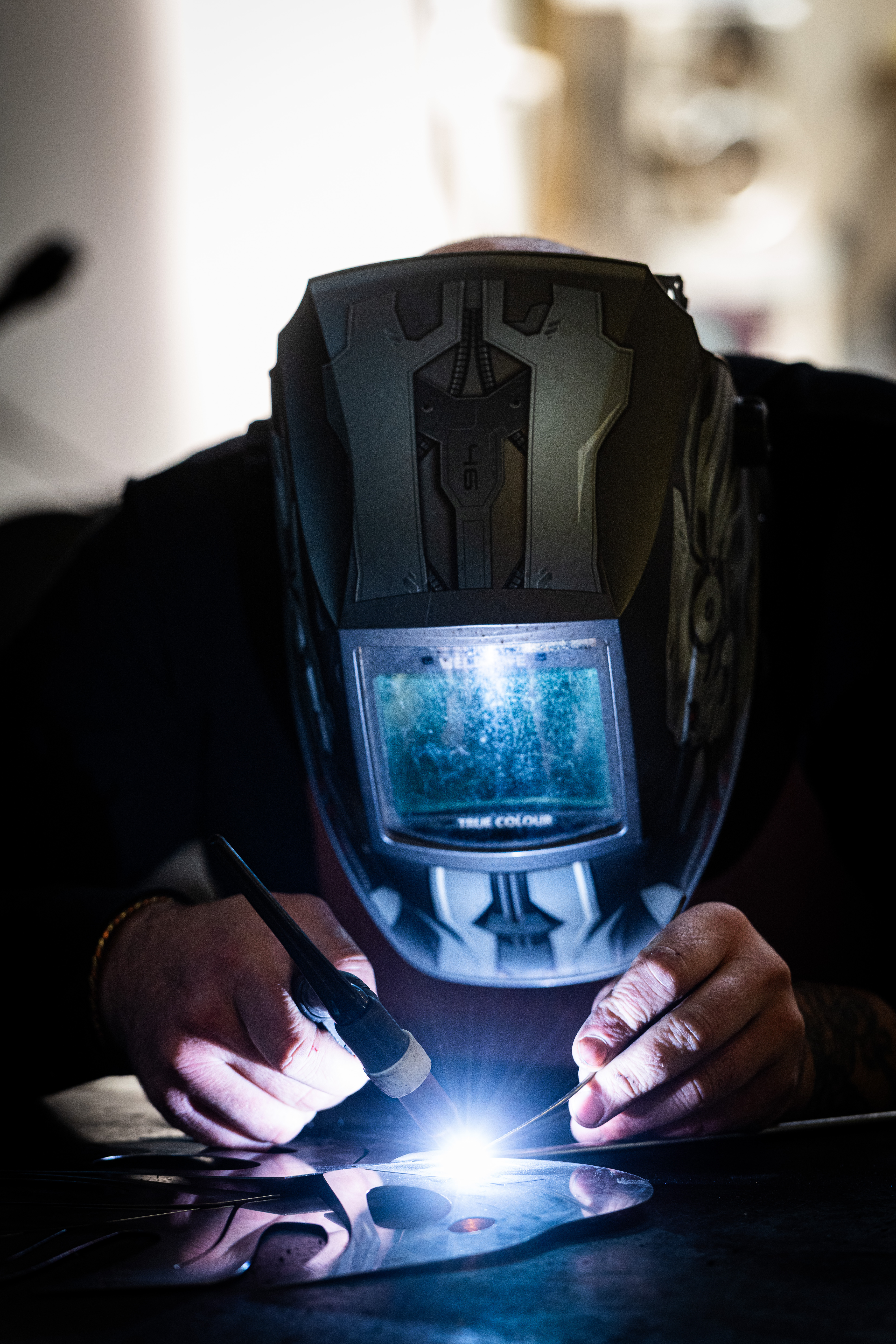 Close-up welding with dramatic helmet